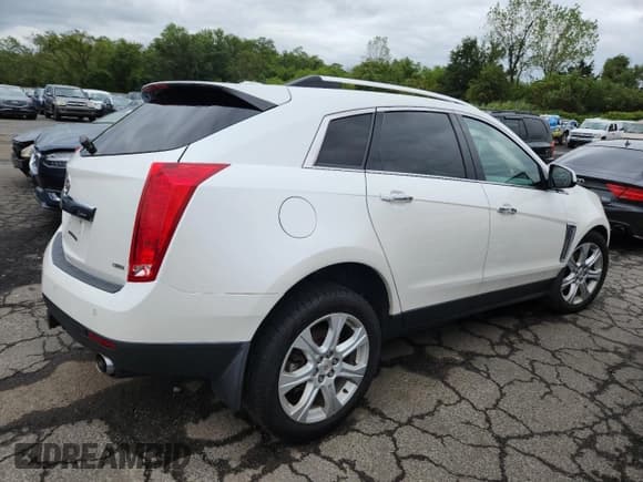 ✅ 2015 Cadillac SRX Performance Collection • VIN: 3GYFNFE31FS531821 • Lot: 68568995. Listed on Copart with 90,227 mi. Free auction sales archive from the USA and detailed vehicle history report at DreamBid. Image 3.