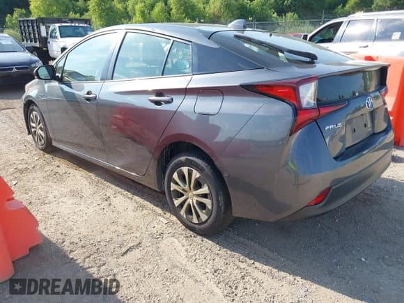 ✅ 2021 Toyota Prius L Eco • VIN: JTDKAMFU2M3147335 • Lot: 42652103. Listed on IAAI with 122,658 mi. Free auction sales archive from the USA and detailed vehicle history report at DreamBid. Image 3.