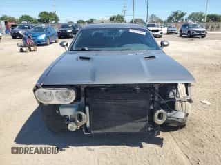 2012 Dodge Challenger SXT z VIN 2C3CDYAG7CH180240, wystawiony jako Copart lot #73298884 z przebiegiem 165 005 mil mil oraz Szkoda całkowita • Salvage title. Historia ofert i sprzedaży dostępna na DreamBid. Obrazek 5.
