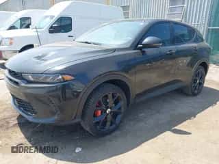 2024 Dodge Hornet GT Plus z VIN ZACNDFBNXR3A24875, wystawiony jako IAAI lot #42227569 z przebiegiem 12 173 mil mil oraz . Historia ofert i sprzedaży dostępna na DreamBid. Obrazek 2.