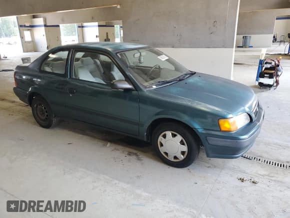 ✅ 1995 Toyota Tercel DX • VIN: JT2EL56DXS0076213 • Lot: 60622915. Listed on Copart with 206,968 mi. Free auction sales archive from the USA and detailed vehicle history report at DreamBid. Image 4.