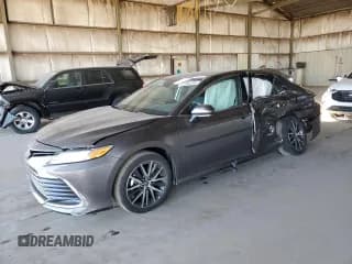 ✅ 2024 Toyota Camry Hybrid XLE • VIN: 4T1F31AK1RU067909 • Lot: 91294195. Listed on Copart with 23,397 mi. Free auction sales archive from the USA and detailed vehicle history report at DreamBid. Image 1.