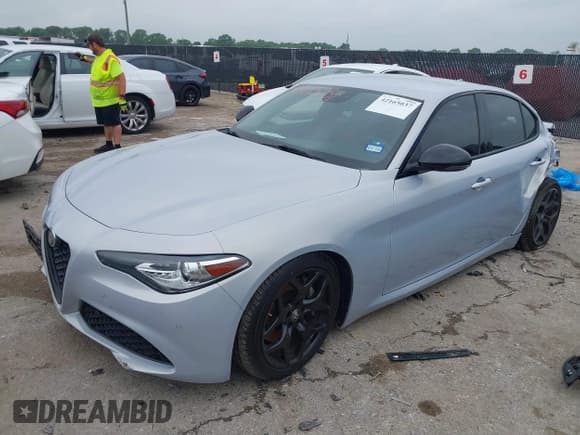 ✅ 2021 Alfa Romeo Giulia • VIN: ZARFAMAN6M7645490 • Lot: 42165037. Listed on IAAI with 57,701 mi. Free auction sales archive from the USA and detailed vehicle history report at DreamBid. Image 2.