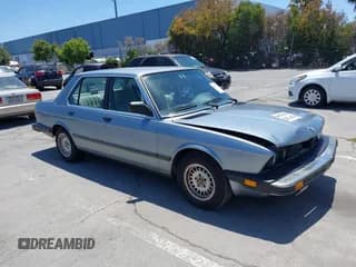 ✅ 1986 BMW 5 Series 528e • VIN: WBADK830XG9704232 • Lot: 42435898. Listed on IAAI with 215,913 mi. Free auction sales archive from the USA and detailed vehicle history report at DreamBid. Image 1.