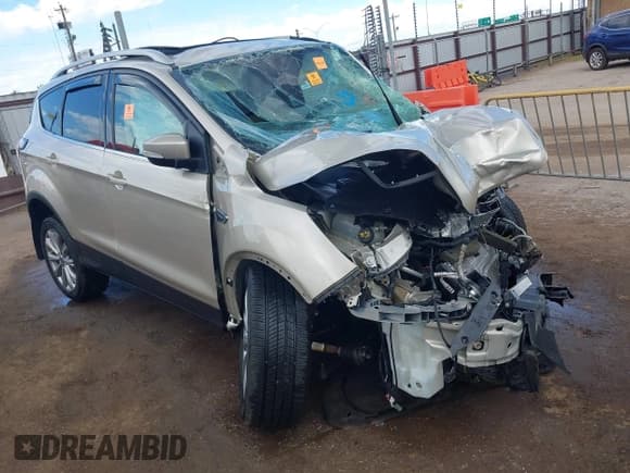 ✅ 2017 Ford Escape Titanium • VIN: 1FMCU9J96HUD18207 • Lot: 43267590. Listed on IAAI with Not provided. Free auction sales archive from the USA and detailed vehicle history report at DreamBid. Image 1.
