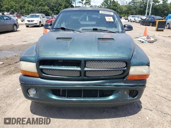 1999 Dodge Dakota SLT z VIN 1B7GL22X0XS145128, wystawiony jako Copart lot #64959364 z przebiegiem 96 047 mil mil oraz Szkoda całkowita • Salvage title. Historia ofert i sprzedaży dostępna na DreamBid. Obrazek 5.