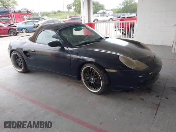 ✅ 2003 Porsche Boxster • VIN: WP0CA29893U620342 • Lot: 42202533. Listed on IAAI with 141,397 mi. Free auction sales archive from the USA and detailed vehicle history report at DreamBid. Image 1.