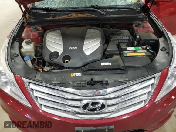 2013 Hyundai Azera z VIN KMHFG4JGXDA298805, wystawiony jako Copart lot #52414485 z przebiegiem 109 812 mil mil oraz Szkoda całkowita • Salvage title. Historia ofert i sprzedaży dostępna na DreamBid. Obrazek 11.