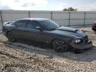 2009 Dodge Charger SXT with VIN 2B3KA33V49H514054, listed as a Copart auction lot 55347824 with 203,389 mi miles and Salvage title. Bid and sale history available at DreamBid. Image 4.