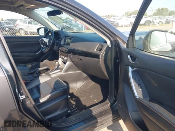 ✅ 2014 Mazda CX-5 Grand Touring • VIN: JM3KE4DY7E0407197 • Lot: 43166476. Wystawiony na IAAI z przebiegiem 217 226 mil. Bezpłatny archiwum sprzedaży aukcyjnych z USA i szczegółowy raport historii pojazdu na DreamBid. Zdjęcie 5.