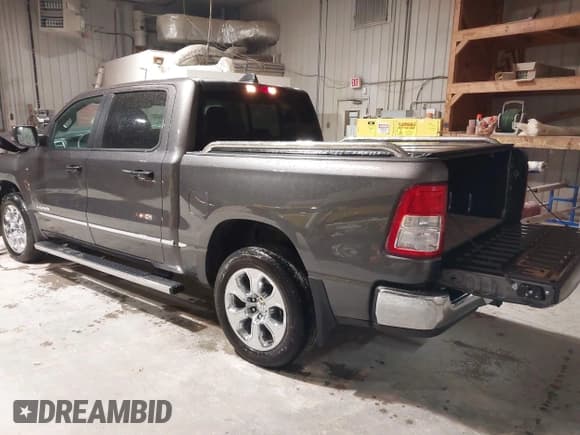 ✅ 2023 Ram 1500 Big Horn • VIN: 1C6RRFFG4PN667047 • Lot: 42300495. Listed on IAAI with 5,061 mi. Free auction sales archive from the USA and detailed vehicle history report at DreamBid. Image 3.