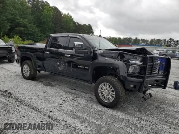 2022 Chevrolet Silverado 2500HD High Country with VIN 1GC4YREY8NF203395, listed as a Copart auction lot 58822955 with 129,552 mi miles and Salvage title. Bid and sale history available at DreamBid. Image 4.