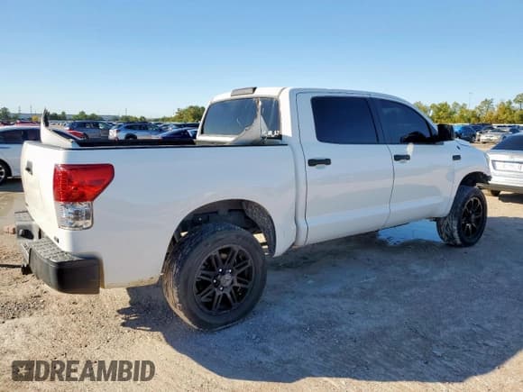 ✅ 2012 Toyota Tundra • VIN: 5TFDW5F15CX262590 • Lot: 90326805. Listed on Copart with 142,079 mi. Free auction sales archive from the USA and detailed vehicle history report at DreamBid. Image 3.