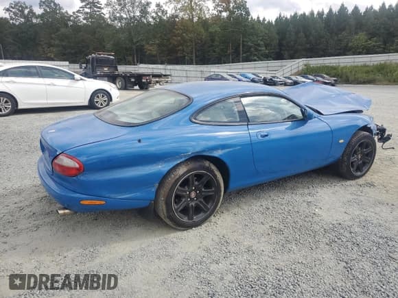 ✅ 1998 Jaguar XK • VIN: SAJJGAED3AR025857 • Lot: 84219455. Listed on Copart with Not provided. Free auction sales archive from the USA and detailed vehicle history report at DreamBid. Image 3.