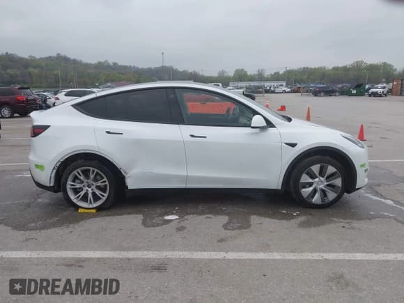✅ 2023 Tesla Model Y Long Range • VIN: 7SAYGDEE9PA069095 • Lot: 41986700. Listed on IAAI with 19,484 mi. Free auction sales archive from the USA and detailed vehicle history report at DreamBid. Image 14.