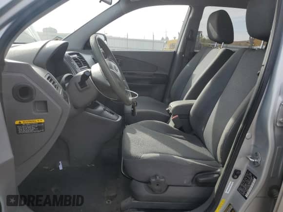 2009 Hyundai Tucson GLS with VIN KM8JM12B79U012399, listed as a Copart auction lot 77663414 with 164,615 mi miles and Salvage title. Bid and sale history available at DreamBid. Image 7.
