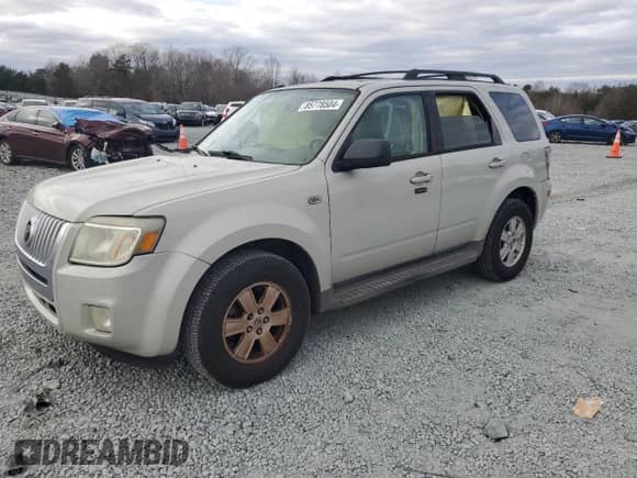 2009 Mercury Mariner with VIN 4M2CU81759KJ04555, listed as a Copart auction lot 85778504 with 130,514 mi miles and Salvage title. Bid and sale history available at DreamBid. Image 1.