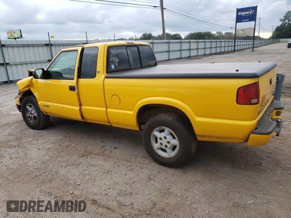 2003 Chevrolet S-10 LS z VIN 1GCDT19X738170604, wystawiony jako Copart lot #71738764 z przebiegiem Nie podano mil oraz Szkoda całkowita • Salvage title. Historia ofert i sprzedaży dostępna na DreamBid. Obrazek 2.