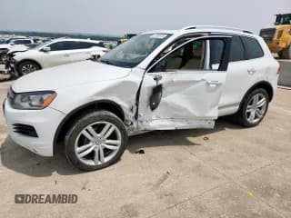 ✅ 2013 Volkswagen Touareg Exec • VIN: WVGEF9BP3DD012463 • Lot: 57499915. Listed on Copart with 104,981 mi. Free auction sales archive from the USA and detailed vehicle history report at DreamBid. Image 1.