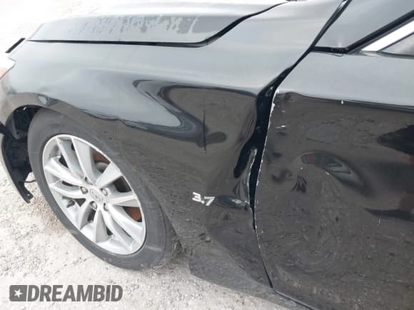 ✅ 2014 Infiniti Q50 Premium • VIN: JN1BV7AP4EM671267 • Lot: 42296272. Listed on IAAI with 206,094 mi. Free auction sales archive from the USA and detailed vehicle history report at DreamBid. Image 15.