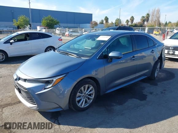 ✅ 2023 Toyota Corolla Hybrid LE • VIN: JTDBCMFEXP3006343 • Лот: 41056503. Опубликован ранее на IAAI с пробегом 121 690 миль. Бесплатный доступ к архиву аукционных продаж из США и подробный отчёт об истории автомобиля на DreamBid. Изображение 2.