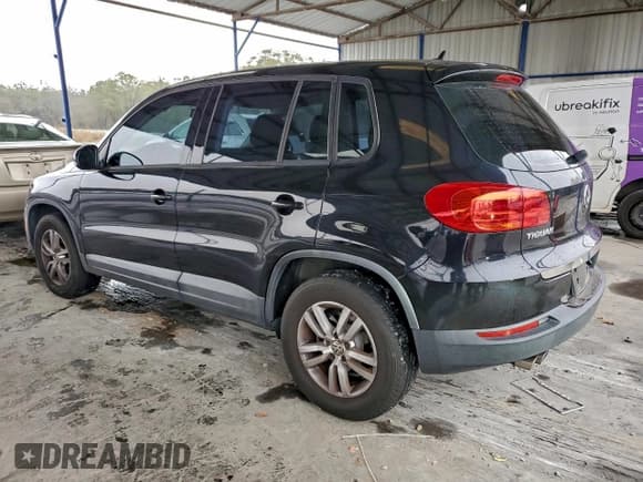 ✅ 2013 Volkswagen Tiguan S • VIN: WVGAV3AX2DW597217 • Lot: 95880665. Listed on Copart with 147,944 mi. Free auction sales archive from the USA and detailed vehicle history report at DreamBid. Image 2.