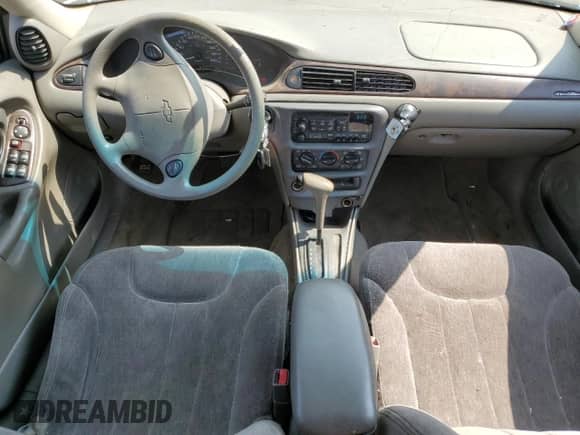 1998 Chevrolet Malibu LS z VIN 1G1NE52MXWY193037, wystawiony jako Copart lot #64394084 z przebiegiem 216 818 mil mil oraz Szkoda całkowita • Salvage title. Historia ofert i sprzedaży dostępna na DreamBid. Obrazek 8.