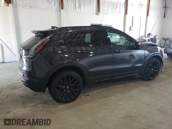 ✅ 2023 Cadillac XT4 AWD Sport • VIN: 1GYFZFR41PF103650 • Лот: 59321355. Опубликован ранее на Copart с пробегом 27 092 миль. Бесплатный доступ к архиву аукционных продаж из США и подробный отчёт об истории автомобиля на DreamBid. Изображение 3.