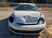 ✅ 2014 Volkswagen Beetle 2.0L TDI • VIN: 3VW5L7AT5EM806416 • Lot: 86837594. Listed on Copart with 263,447 mi. Free auction sales archive from the USA and detailed vehicle history report at DreamBid. Image 5.