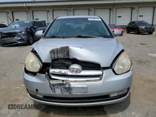 2007 Hyundai Accent SE with VIN KMHCN36CX7U038061, listed as a Copart auction lot 63790134 with 104,618 mi miles and Salvage title. Bid and sale history available at DreamBid. Image 5.