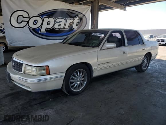 ✅ 1998 Cadillac DeVille • VIN: 1G6KF5496WU745580 • Lot: 69912165. Listed on Copart with 119,649 mi. Free auction sales archive from the USA and detailed vehicle history report at DreamBid. Image 1.