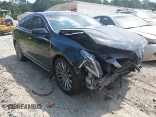 ✅ 2015 Lincoln MKS • VIN: 1LNHL9DK3FG601408 • Lot: 42593312. Wystawiony na IAAI z przebiegiem 104 278 mil. Bezpłatny archiwum sprzedaży aukcyjnych z USA i szczegółowy raport historii pojazdu na DreamBid. Zdjęcie 1.