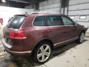 ✅ 2017 Volkswagen Touareg Executive • VIN: WVGGF7BP5HD001497 • Lot: 39641554. Listed on Copart with 81,525 mi. Free auction sales archive from the USA and detailed vehicle history report at DreamBid. Image 3.