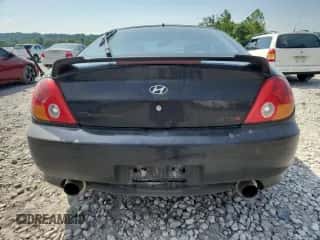 2003 Hyundai Tiburon GT с VIN KMHHN65F13U071950, выставлен на аукционе Copart как лот 62307475 с пробегом 173 191 миль миль и Списание • Salvage title. История ставок и продаж доступна на DreamBid. Изображение 6.