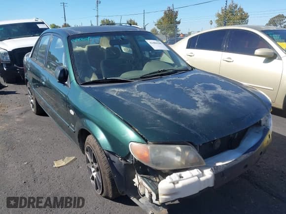 ✅ 2002 Mazda Protege DX • VIN: JM1BJ225021620967 • Lot: 43484388. Wystawiony na IAAI z przebiegiem 200 574 mil. Bezpłatny archiwum sprzedaży aukcyjnych z USA i szczegółowy raport historii pojazdu na DreamBid. Zdjęcie 6.