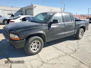 2003 Dodge Dakota Sport z VIN 1D7HL38N03S172331, wystawiony jako Copart lot #78851764 z przebiegiem 162 521 mil mil oraz Czysty tytuł • Clean title. Historia ofert i sprzedaży dostępna na DreamBid. Obrazek 1.