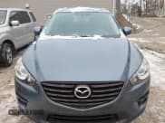 ✅ 2016 Mazda CX-5 Touring • VIN: JM3KE4CY6G0874938 • Lot: 43869585. Listed on IAAI with 180,000 mi. Free auction sales archive from the USA and detailed vehicle history report at DreamBid. Image 12.