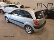 ✅ 2009 Kia Rio SX • VIN: KNADE243096570901 • Lot: 42237845. Listed on IAAI with 213,271 mi. Free auction sales archive from the USA and detailed vehicle history report at DreamBid. Image 3.