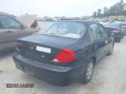 ✅ 2003 Kia Spectra • VIN: KNAFB121535246949 • Lot: 42402307. Listed on IAAI with 98,678 mi. Free auction sales archive from the USA and detailed vehicle history report at DreamBid. Image 4.