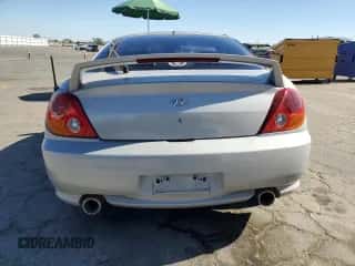 2003 Hyundai Tiburon GT с VIN KMHHN65F73U101856, выставлен на аукционе Copart как лот 64248815 с пробегом 59 622 миль миль и Списание • Salvage title. История ставок и продаж доступна на DreamBid. Изображение 6.