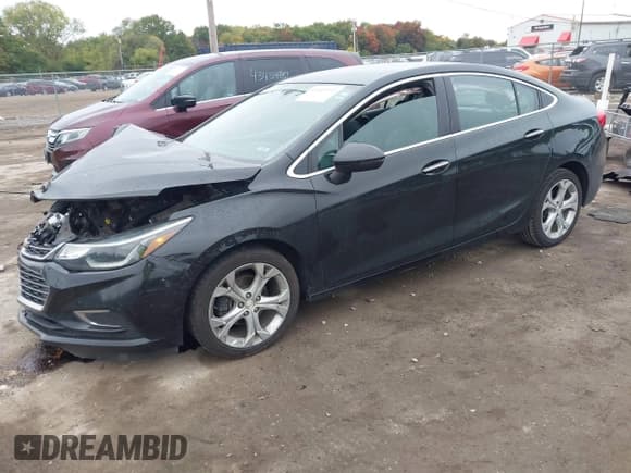 ✅ 2018 Chevrolet Cruze Premier • VIN: 1G1BF5SM1J7141701 • Lot: 43449111. Listed on IAAI with 128,825 mi. Free auction sales archive from the USA and detailed vehicle history report at DreamBid. Image 2.