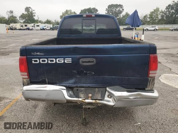 2002 Dodge Dakota SLT z VIN 1B7HL48XX2S724854, wystawiony jako Copart lot #71327325 z przebiegiem 184 782 mil mil oraz Szkoda całkowita • Salvage title. Historia ofert i sprzedaży dostępna na DreamBid. Obrazek 6.
