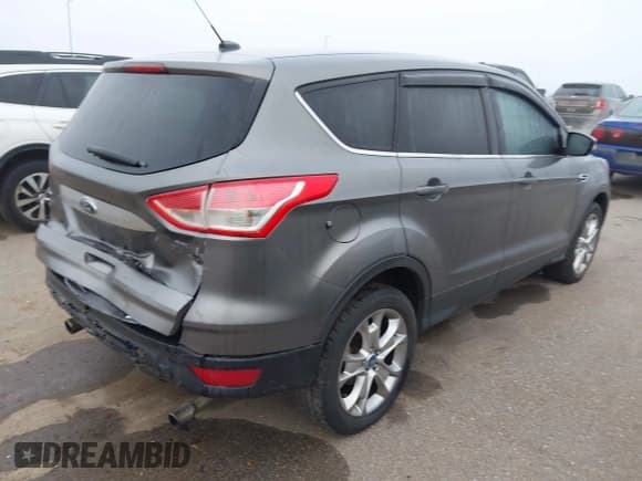 ✅ 2013 Ford Escape SEL • VIN: 1FMCU0H9XDUA10114 • Lot: 43535463. Listed on IAAI with 156,487 mi. Free auction sales archive from the USA and detailed vehicle history report at DreamBid. Image 4.