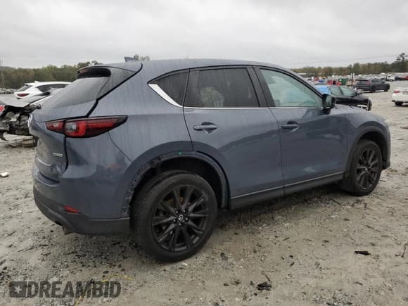 ✅ 2022 Mazda CX-5 S Carbon Edition • VIN: JM3KFBCM2N1623890 • Лот: 90045285. Опубликован ранее на Copart с пробегом Не указан. Бесплатный доступ к архиву аукционных продаж из США и подробный отчёт об истории автомобиля на DreamBid. Изображение 3.