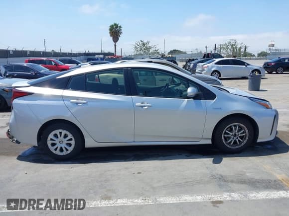 ✅ 2021 Toyota Prius L Eco • VIN: JTDKAMFU8M3150739 • Лот: 42548652. Опубликован ранее на IAAI с пробегом 118 303 миль. Бесплатный доступ к архиву аукционных продаж из США и подробный отчёт об истории автомобиля на DreamBid. Изображение 13.