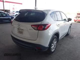 ✅ 2016 Mazda CX-5 Touring • VIN: JM3KE2CYXG0685729 • Lot: 43656761. Listed on IAAI with 223,960 mi. Free auction sales archive from the USA and detailed vehicle history report at DreamBid. Image 4.