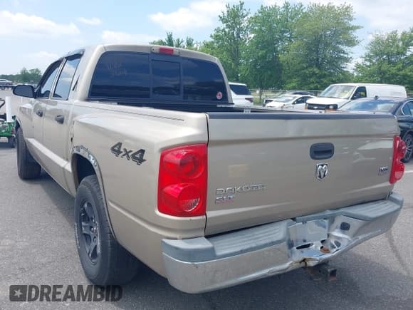 ✅ 2005 Dodge Dakota SLT • VIN: 1D7HW48N95S269592 • Lot: 42675637. Listed on IAAI with 153,456 mi. Free auction sales archive from the USA and detailed vehicle history report at DreamBid. Image 3.