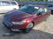 ✅ 2017 Ford Fusion Titanium • VIN: 3FA6P0D90HR231500 • Lot: 42220802. Listed on IAAI with 104,041 mi. Free auction sales archive from the USA and detailed vehicle history report at DreamBid. Image 2.