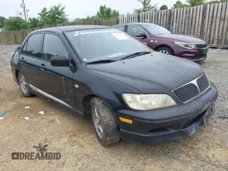 ✅ 2002 Mitsubishi Lancer OZ-Rally • VIN: JA3AJ86E12U024451 • Lot: 42615933. Listed on IAAI with 200,198 mi. Free auction sales archive from the USA and detailed vehicle history report at DreamBid. Image 1.