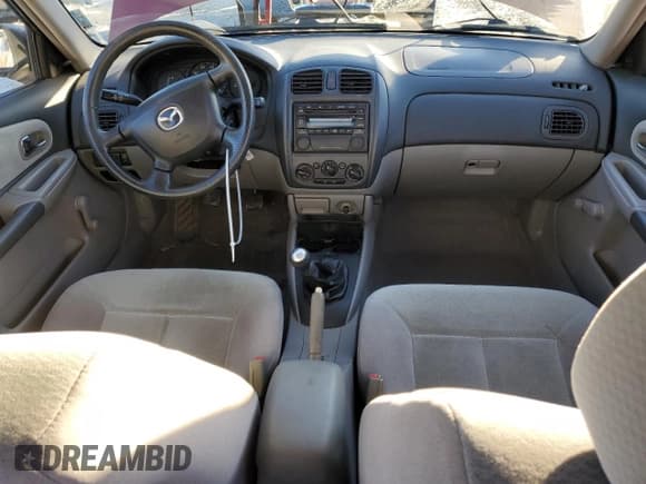 ✅ 2001 Mazda Protege DX • VIN: JM1BJ222610438233 • Lot: 41649375. Listed on Copart with 226,394 mi. Free auction sales archive from the USA and detailed vehicle history report at DreamBid. Image 8.